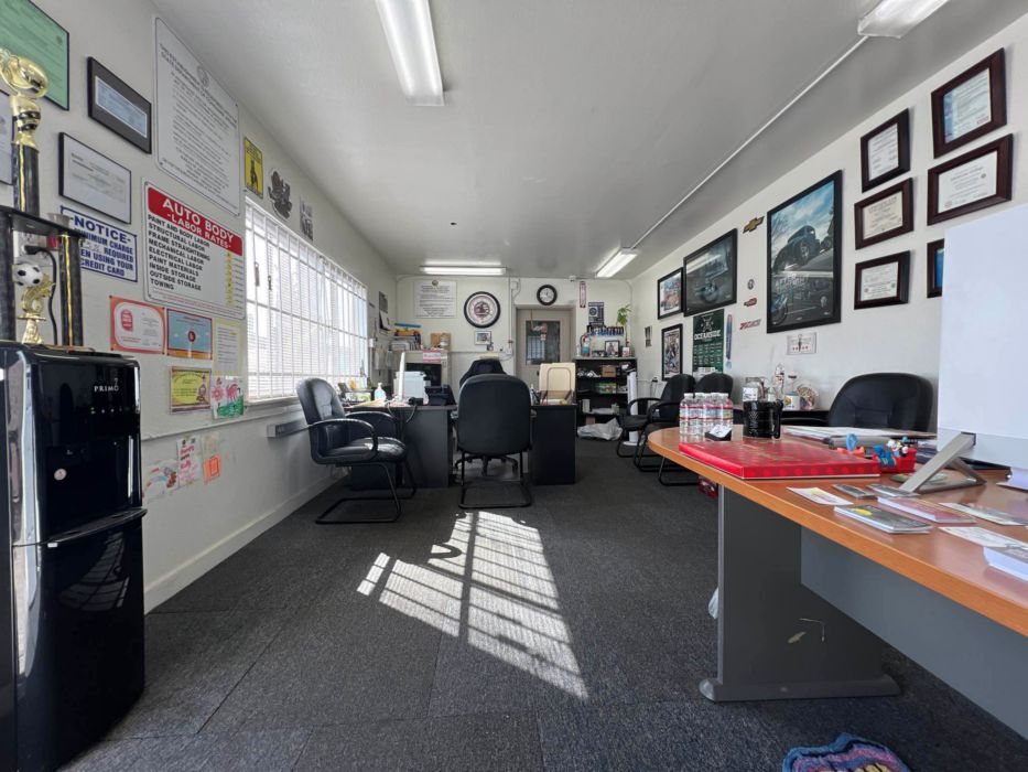 Office interior with framed photos and counter
